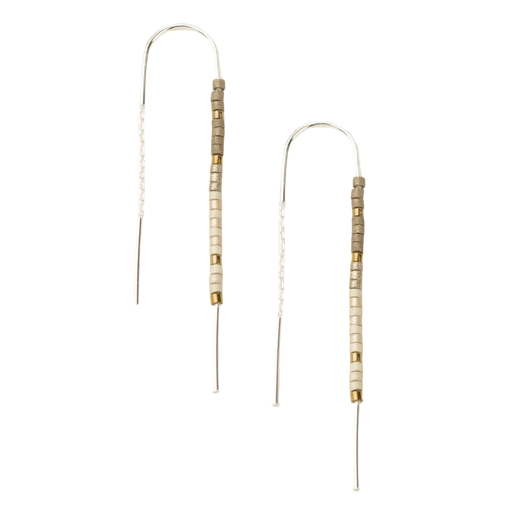 Pair of beaded earrings on a white background. vailable at Be Charmed