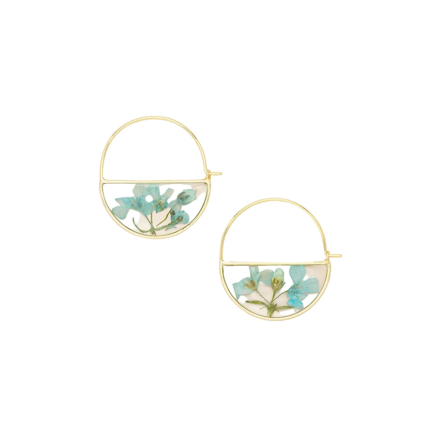 Gold hoop earrings with floral design on a beige background