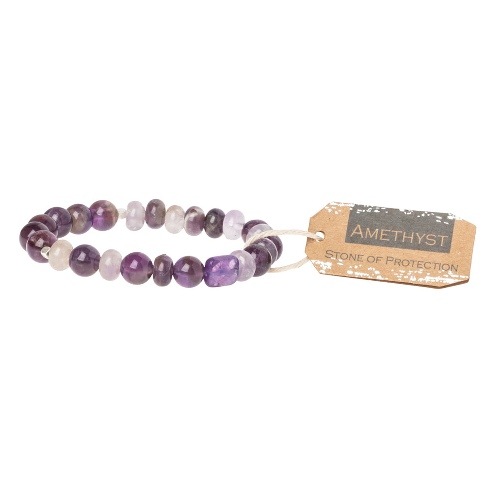 A purple stone stacking bracelet with a label tagged 'stone of protection'. Available at Be Charmed
