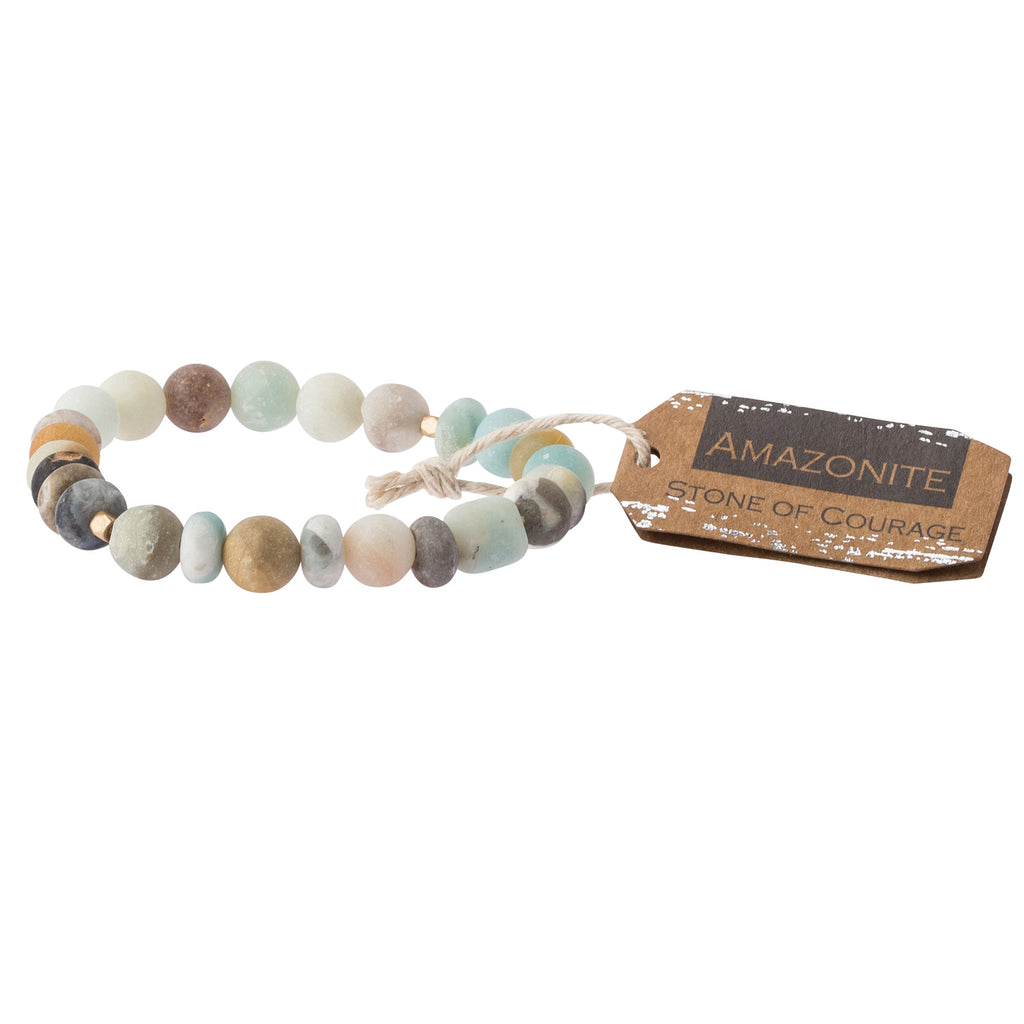 A earthtone stone stacking bracelet with a label tagged 'stone of courage'. Available at Be Chamred