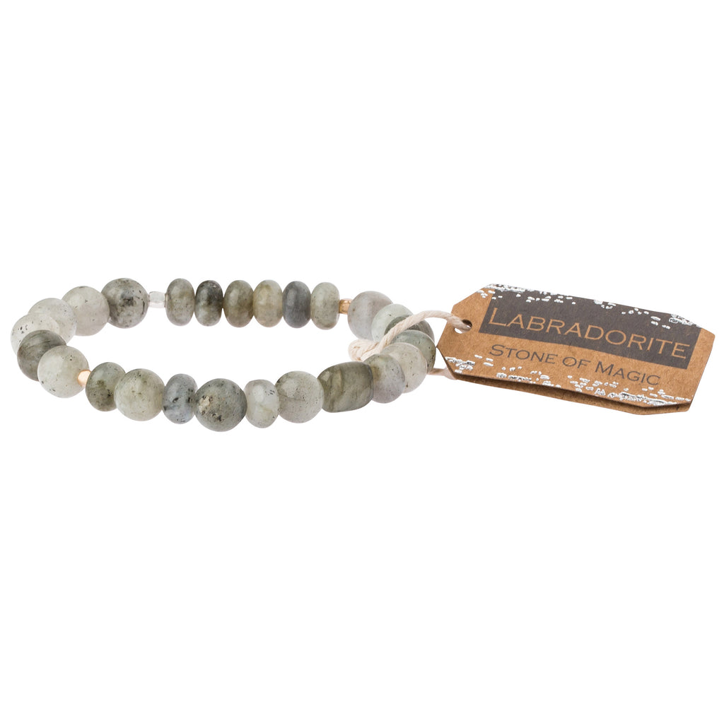A grey stone stacking bracelet with a label tagged 'stone of magic'. Available at Be Charmed