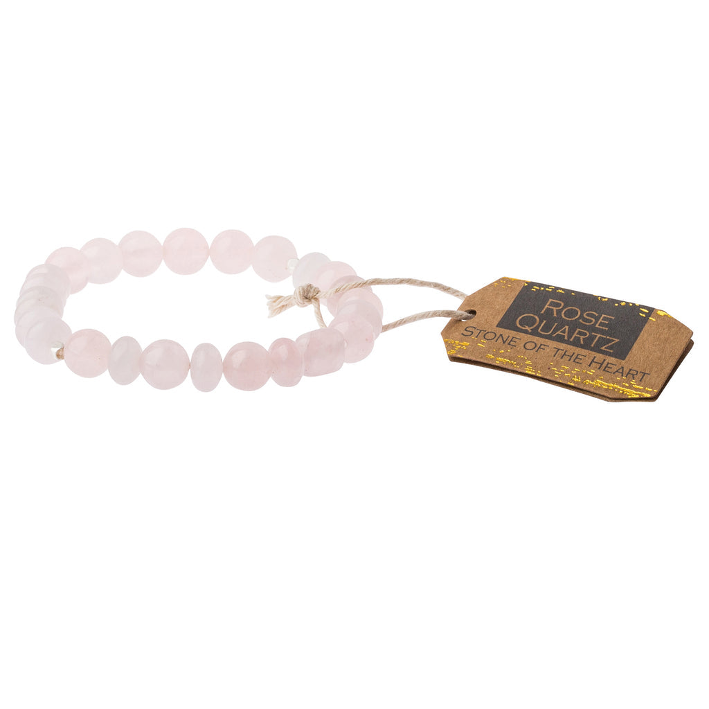 A pink stone stacking bracelet with a label tagged 'stone of the heart'. Available at Be Chamred