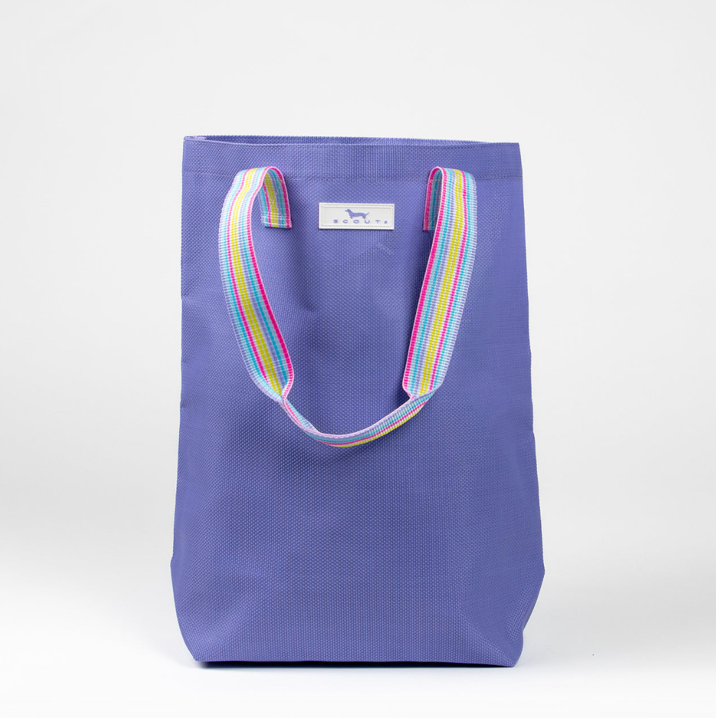 A purple woven Scout tote bag with a multicolored striped handle. Available at Be Charmed