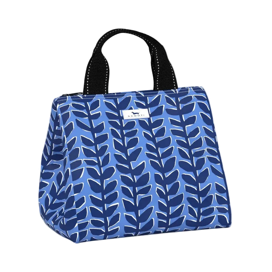 A blue patterned Scout lunch bag with a navy and blue leaf motif, featuring black top handles and a small white brand label on the front. Available at Be Charmed