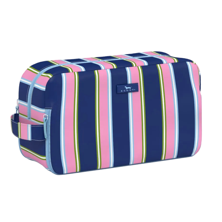 A rectangular zippered Scout pouch with a colorful vertical stripe pattern in navy blue, pink, light blue, yellow, and white, featuring a small blue brand tag on the front. Available at Be Charmed
