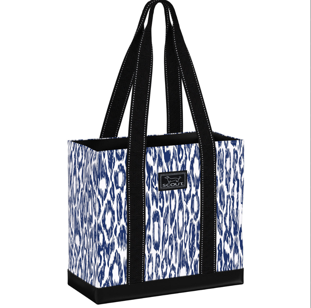 A striped multicolored Scout tote bag with black straps and a black brand logo on the front. Available at Be Charmed
