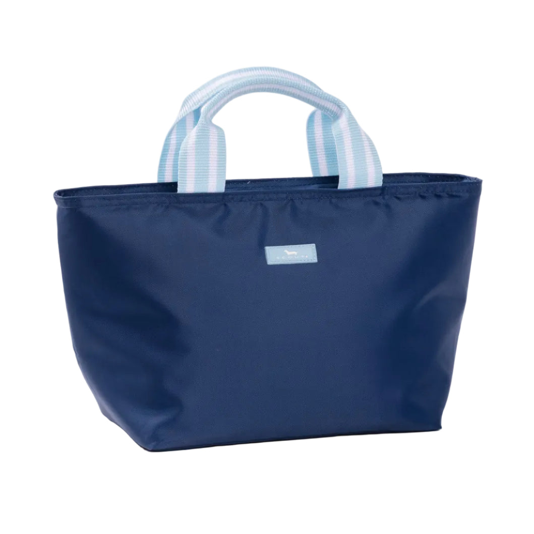 A navy blue insulated Scout lunch bag with light blue and white striped fabric handles, shown on a clean white background. Available at Be Charmed