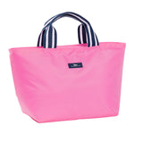 A bright pink insulated Scout lunch bag with navy and white striped fabric handles and a small navy brand patch on the front, photographed on a clean white background. Available at e Charmed