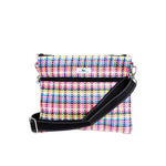 A multicolored woven fabric Scout crossbody bag with a black strap and zipper closure. Available at Be Charmed