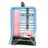 A teacher gift set containing pencils, washi tape, a lanyard, and a clear zip pouch with a geometric pattern on a white background. Available at Be Charmed
