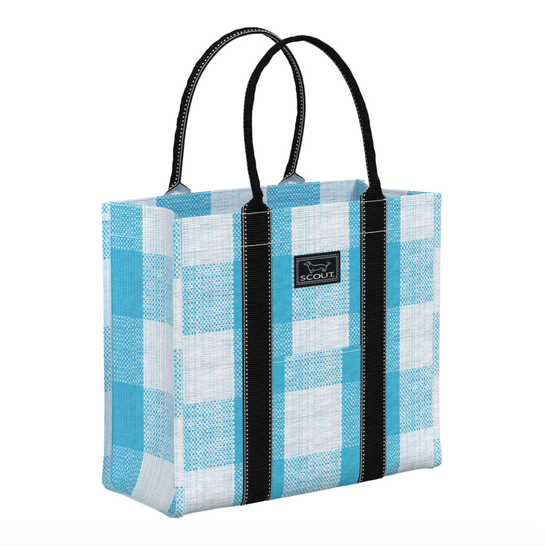 A blue and white checkered scout tote bag with black rolled handles and a brand label visible on the side. Available at Be Charmed