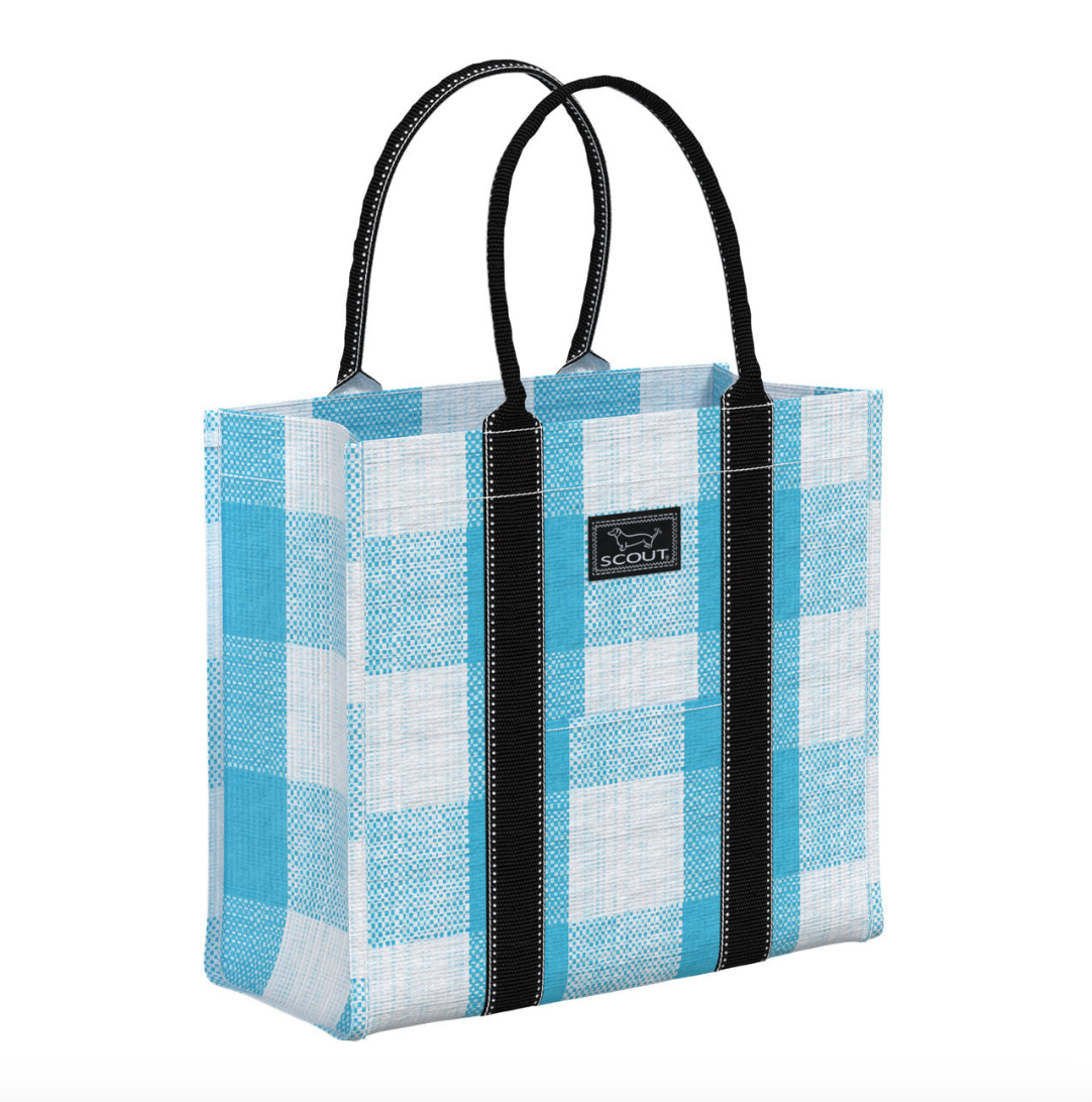 A blue and white checkered scout tote bag with black rolled handles and a brand label visible on the side. Available at Be Charmed
