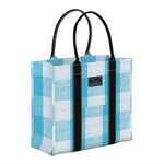 A blue and white checkered scout tote bag with black rolled handles and a brand label visible on the side. Available at Be Charmed