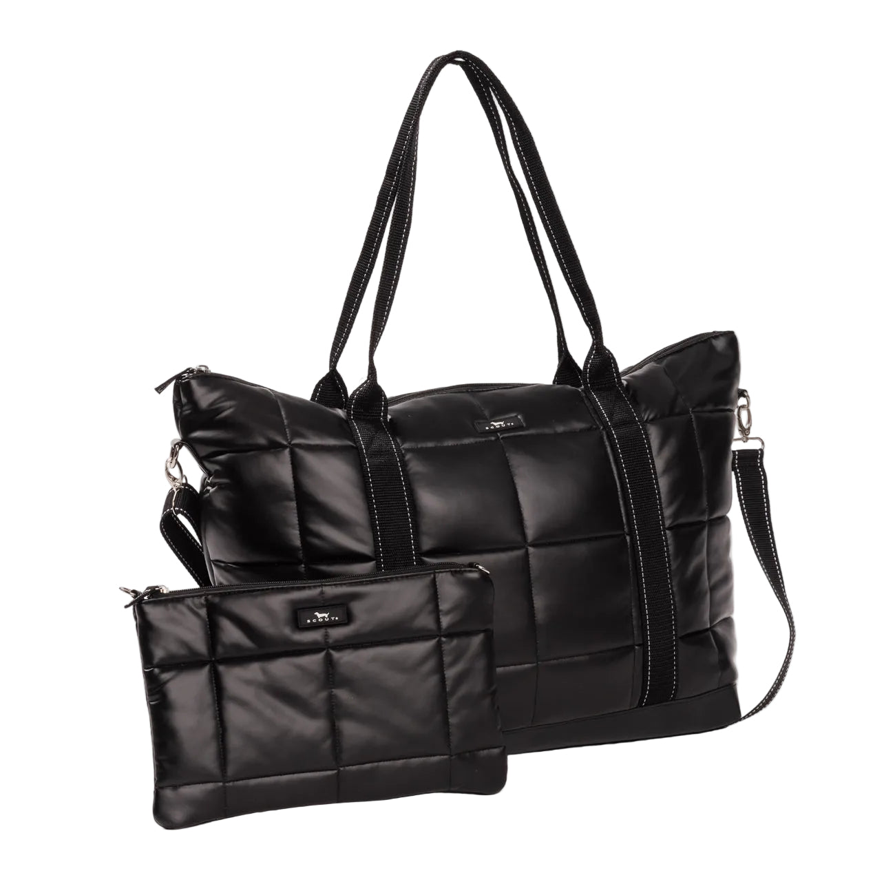 A Scout black quilted puffer tote bag with dual top handles and a detachable shoulder strap, shown alongside a matching small zip pouch on a white  background. Available at Be Charmed