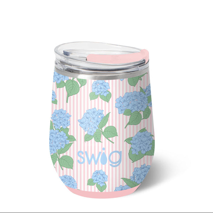 Stainless steel tumbler with floral design and 'Swig' branding on a white background. Available at Be Charmed