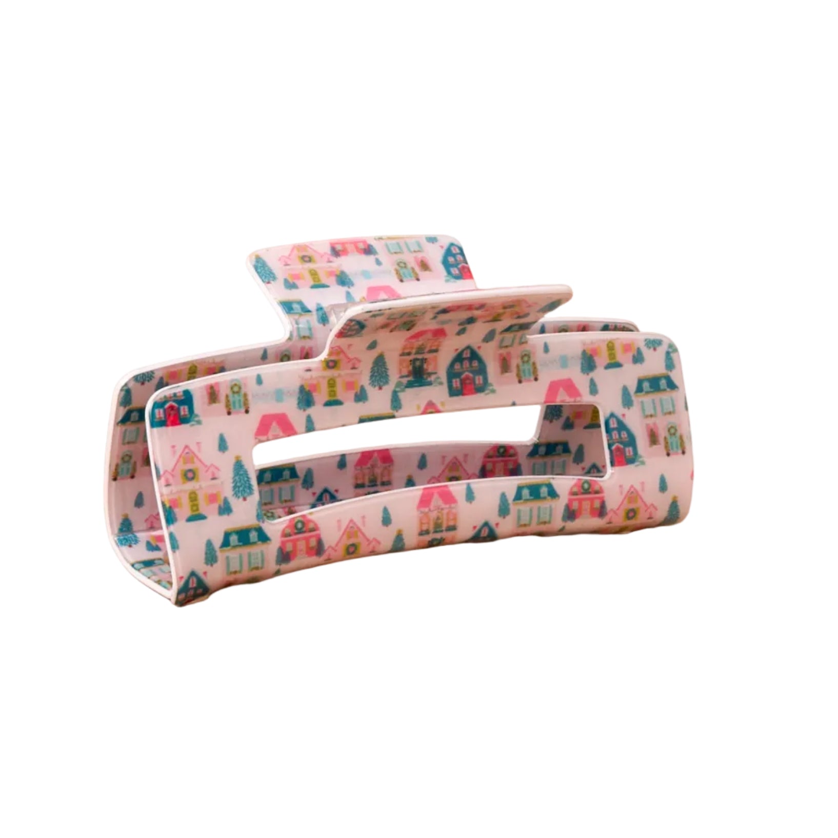 A Darling Effect hair claw clip with a colorful winter village pattern on white background. Available at Be Charmed