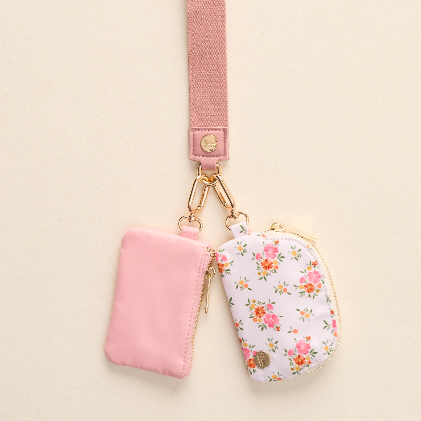 The Darling Effect Cream Dynamic Duo Pouch Wristlet – two coordinating pouches with wrist strap. Available at Be Charmed.
