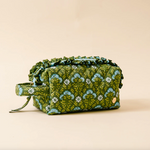 Green floral Everbloom Forest patterned fabric cosmetic bag on a beige background. Available at Be Charmed. 