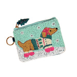 A small zippered Darling Effect pouch decorated with a beaded dachshund wearing a colorful sweater,. Available at Be Charmed
