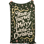 The Darling effect christmas-themed blanket with decorative text and patterns on a white background. Available at Be Charmed. 