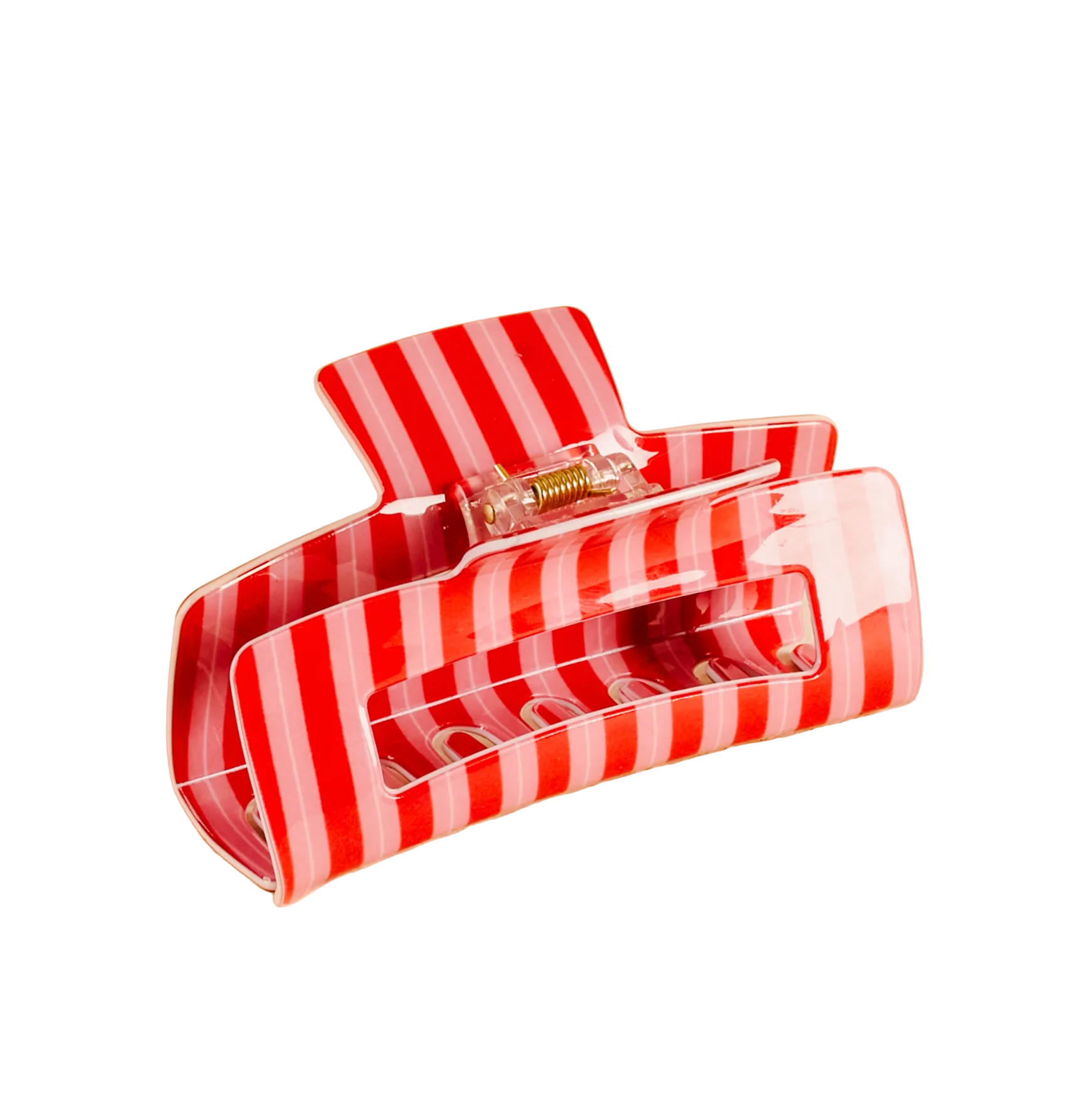 Red and white striped the darling effect hair clip on a beige background. Available at Be Charmed. 