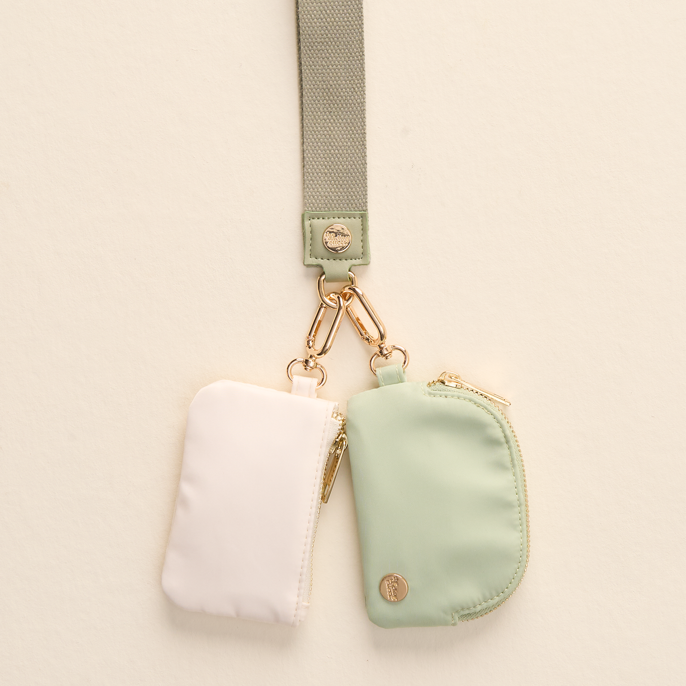 The Darling Effect Sage Dynamic Duo Pouch Wristlet – two coordinating pouches with wrist strap. Available at Be Charmed.