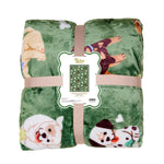 Folded green blanket with dogs on a white background. Available at Be Charmed