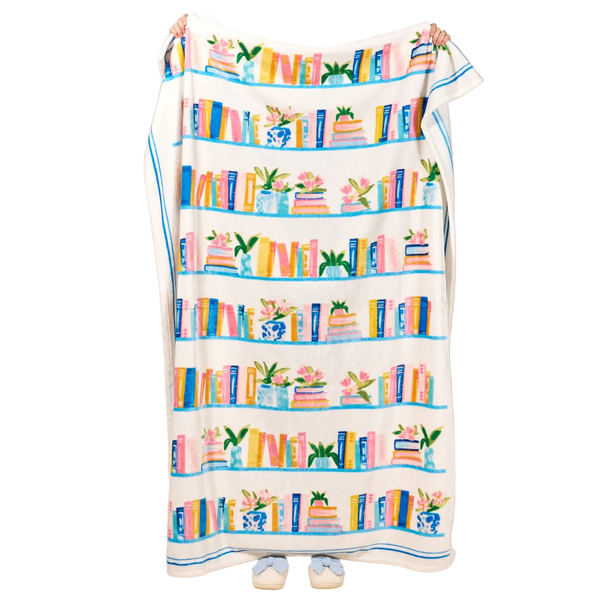 Decorative Darling Effect blanket with book and flower pattern on a white background. Available at Be Charmed