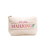 White pouch with 'let's play MAHJONG' text on a white background. Available at Be Charmed