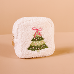 White textured cosmetic pouch with a Christmas tree design on a beige background. Available at Be Charmed.