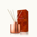 Thymes Simmered Cider Petite Reed Diffuser with warm, spiced fragrance for home ambiance. Available at Be Charmed.