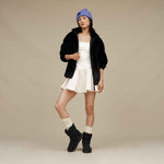 UGG Tash Faux Fur Jacket in Black on modal – chic and cozy women’s outerwear with a modern silhouette. Available at Be Charmed.