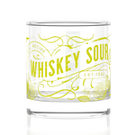 Clear glass with yellow text and design on a white background. Available at Be Charmed